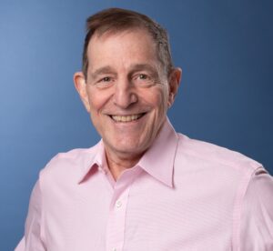 Coach Steve in a pink shirt